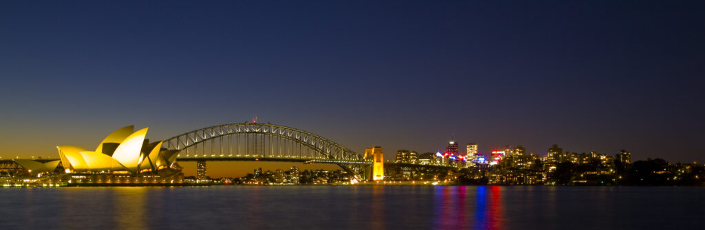Sydney Harbour bridge and the opera house viewed at dusk.