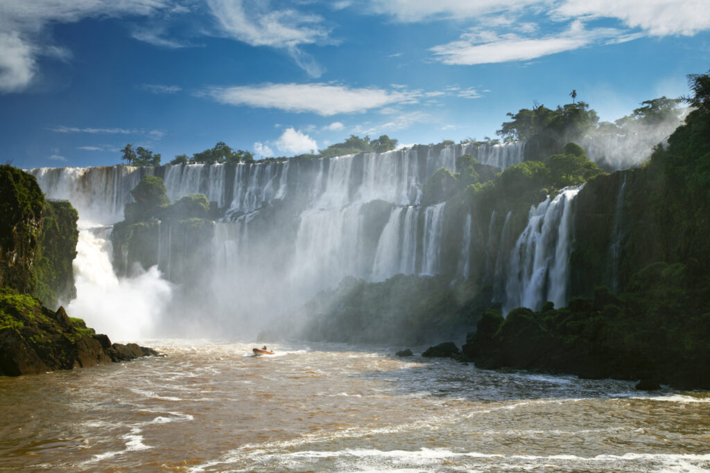 Argentina, Misiones, Iguazu National Park. Tourist boat trip near the impressive Iguazu waterfalls – A world heritage site.