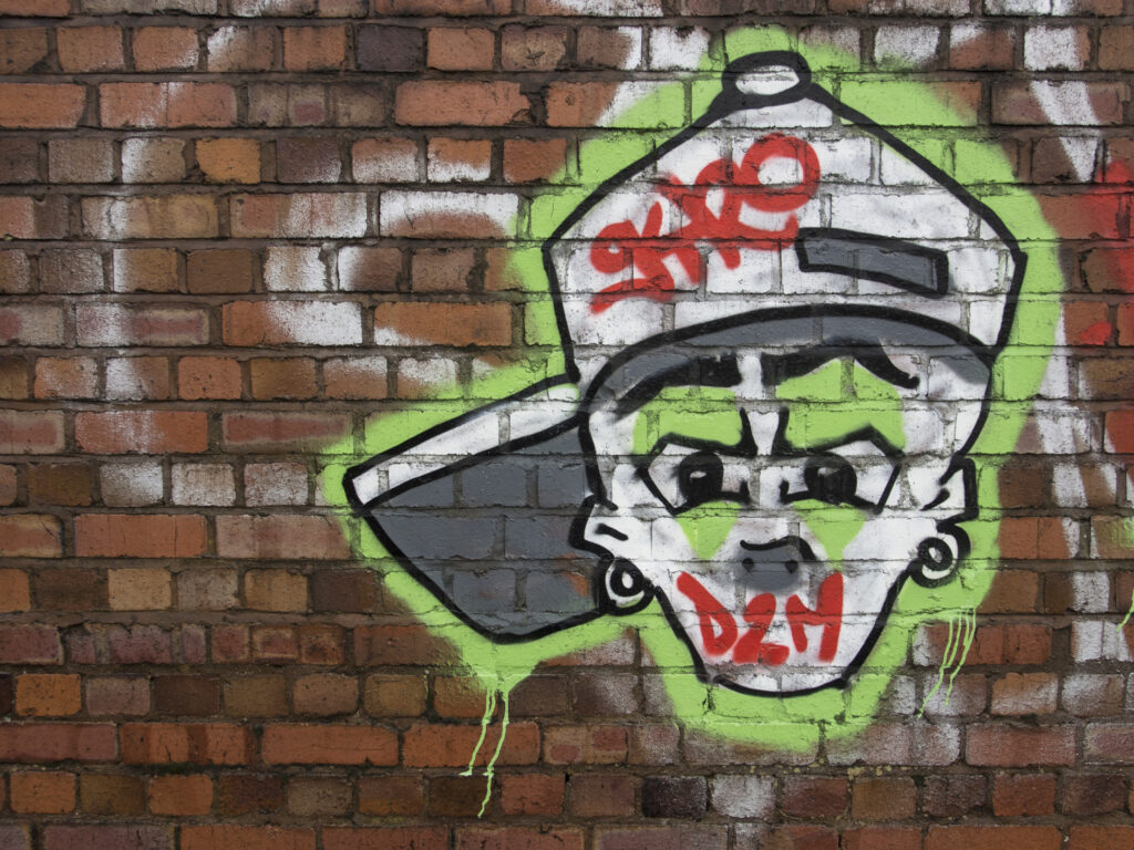 England, West Midlands, Graffiti on wall.